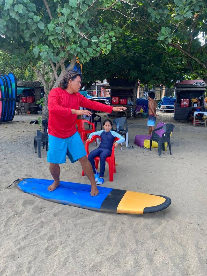 A student practising the pop-up on the sand
