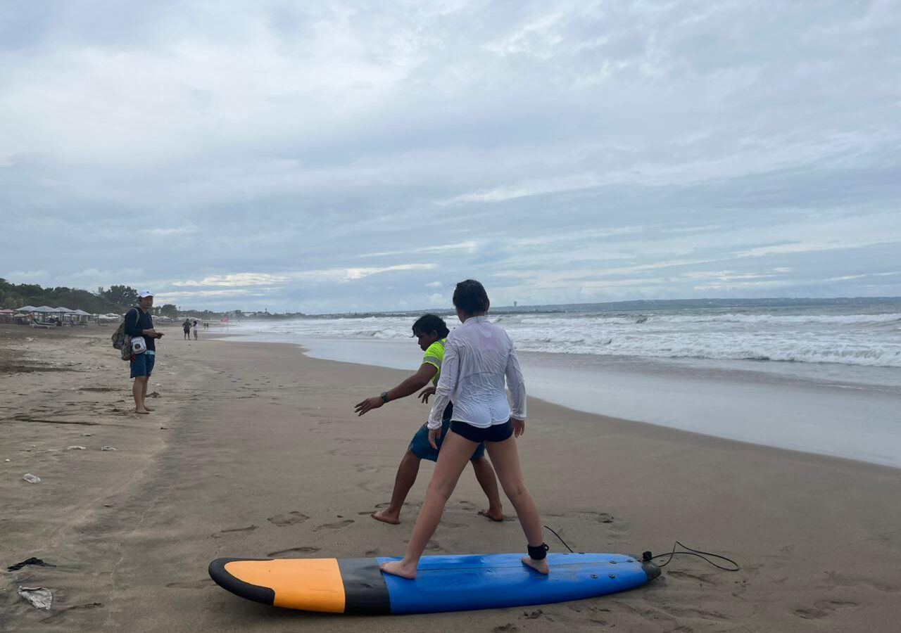 Surfers on the beach at Kuta, Bali